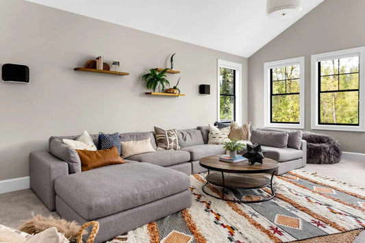 Living room sectional with boho rug