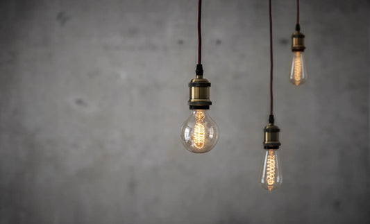 Vintage Edison bulbs in front of concrete wall